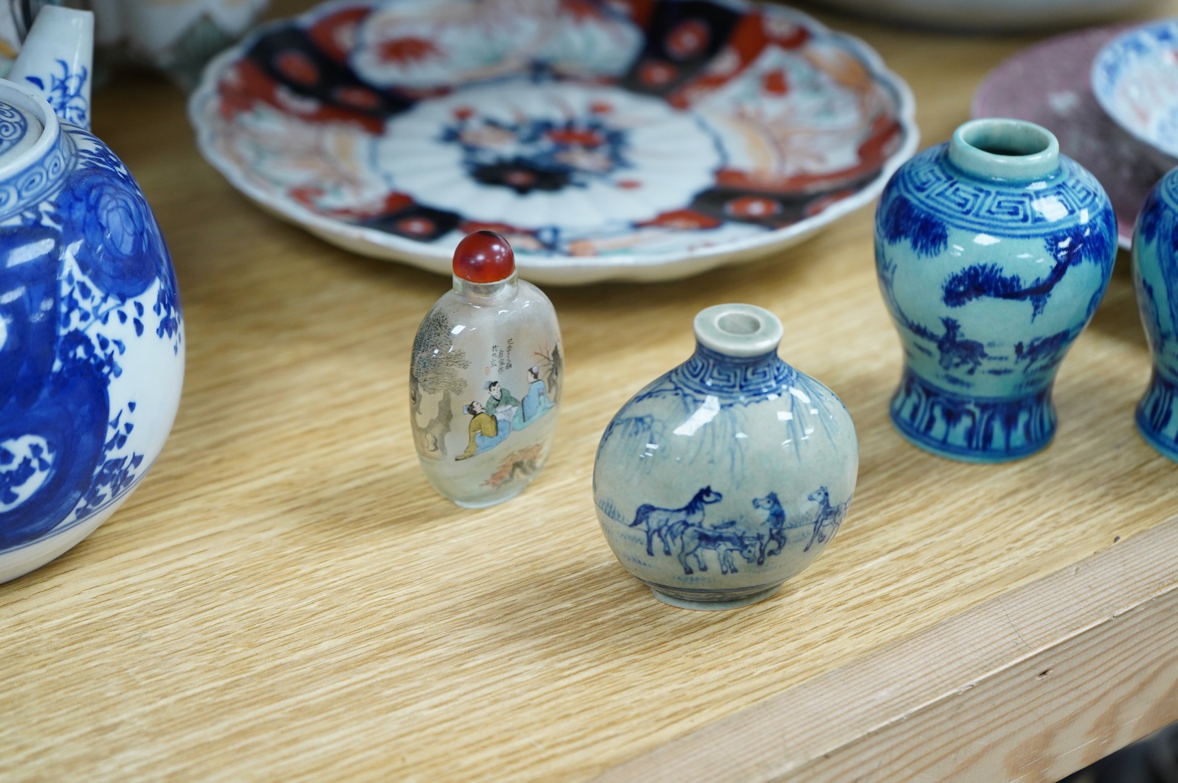 A collection of Asian ceramics to include an inside painted glass snuff bottle, pink ground dish and an Imari dish